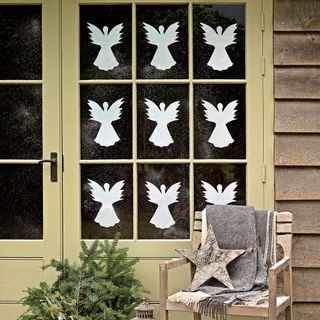 Christmas window with paper angels
