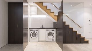 Small utility room ideas - a utility under the stairs by Sonnemann Toon Architects