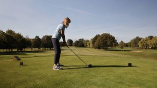 Alison Root teeing off