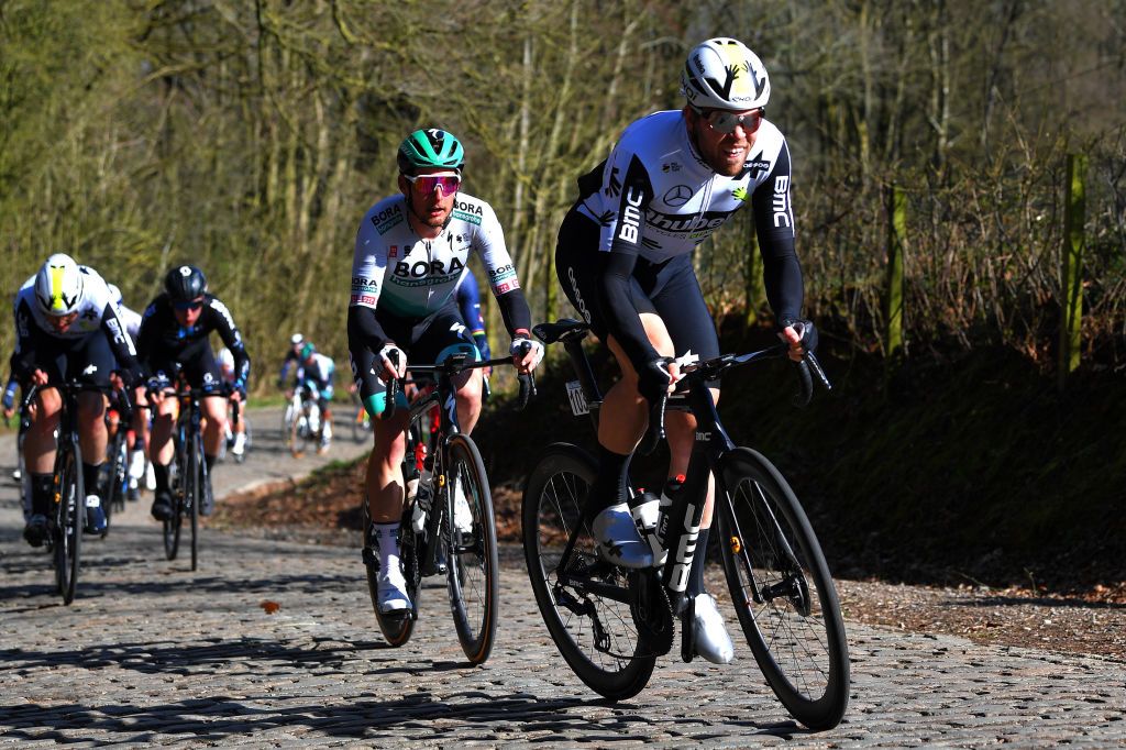 KOKSIJDE BELGIUM MARCH 19 Lasse Norman Hansen of Denmark and Team Qhubeka Assos Lukas Pstlberger of Austria and Team Bora Hansgrohe Max Walscheid of Germany and Team Qhubeka Assos Florian Senechal of France and Team Deceuninck QuickStep during the 19th Bredene Koksijde Classic 2021 a 199km race from Bredene to Koksijde Cobblestones Kemmelberg Breakaway BredeneKoksijde on March 19 2021 in Koksijde Belgium Photo by Luc ClaessenGetty Images
