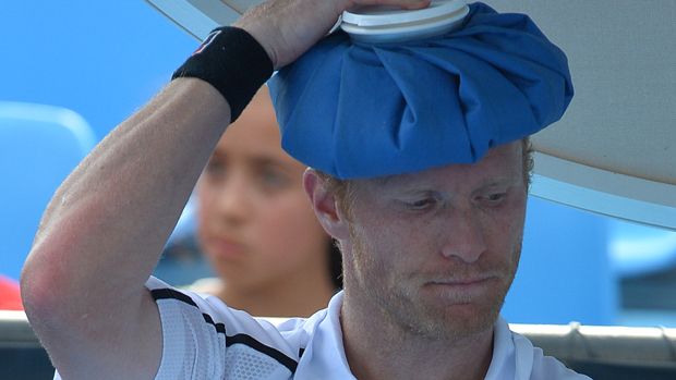 Dmitry Tursunov of Russia cools off during a break in his men&amp;#039;s singles match against Uzbekistan&amp;#039;s Denis Istomin on day three of the 2014 Australian Open tennis tournament in Melbourne on Jan