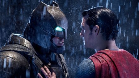 Ben Affleck as Batman and Henry Cavill as Superman standing in the rain during the DC movie Batman v Superman: Dawn of Justice.