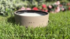 Jo Malone Outdoor Candle on grass outside