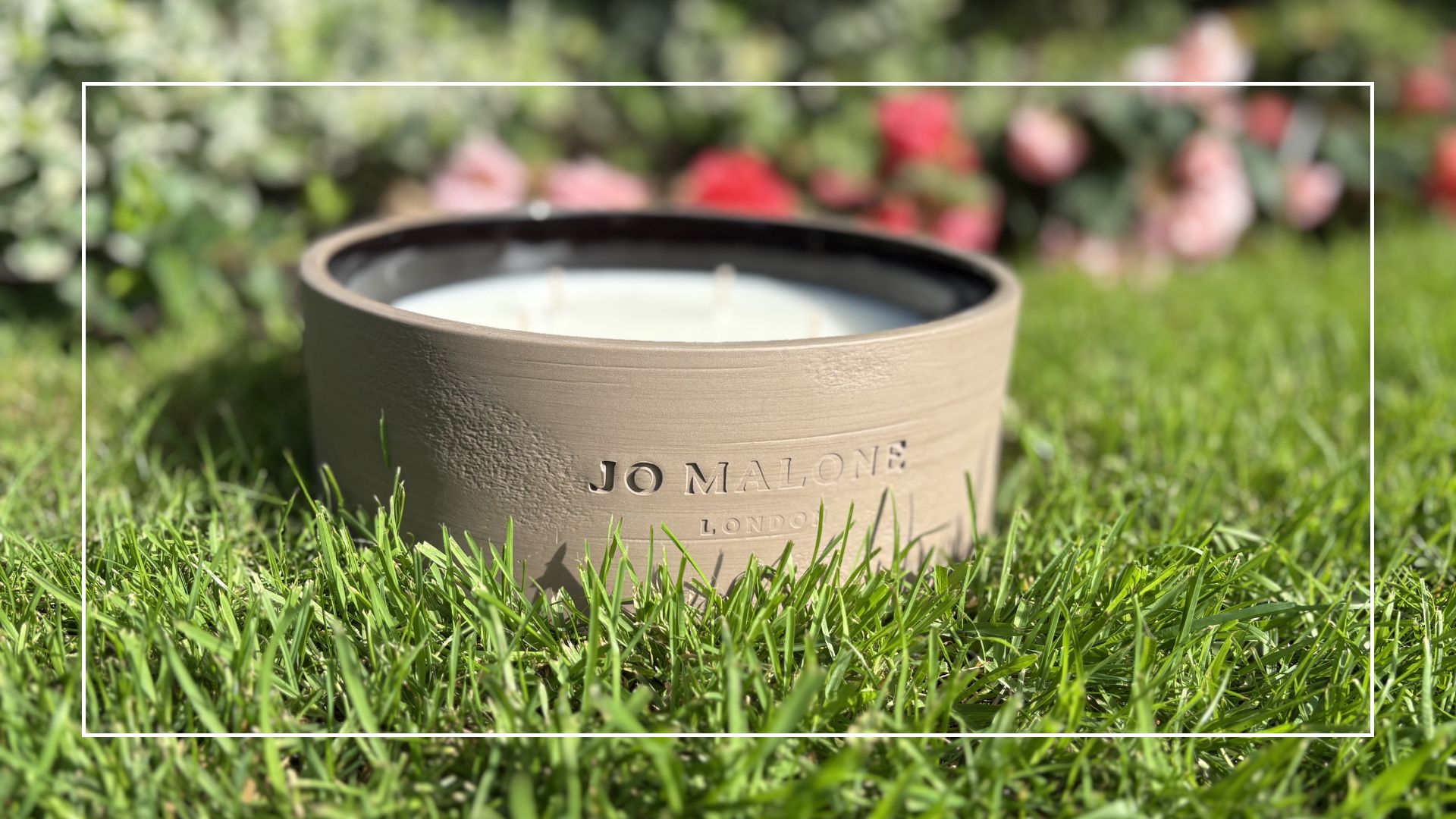 Jo Malone Outdoor Candle on grass outside