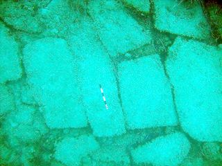 Slabs of cemented sediment at the island site resembled paving that has been seen in classic Greek ruins.
