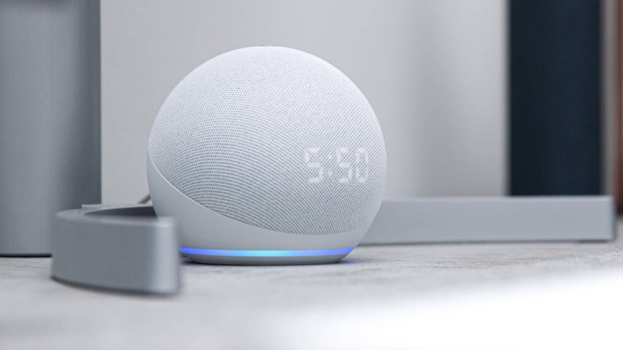 Why I&#039;m switching from Google Assistant to Alexa, a white Echo Dot product sitting on a shelf while displaying the time