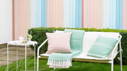 ombre effect fence painted in multiple pastel colors