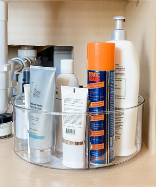 A tidy Lazy Susan used for under sink storage