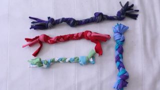 Selection of braided DIY puppy toys made from old shirts