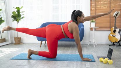 Woman doing a Pilates workout at home