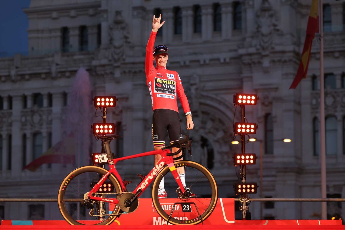 MADRID SPAIN SEPTEMBER 17 Sepp Kuss of The United States and Team JumboVisma Red Leader Jersey celebrates at podium as final overall race winner during the 78th Tour of Spain 2023 Stage 21 a 1015km stage from Hipdromo de la Zarzuela to Madrid Paisaje de la Luz UCIWT on September 17 2023 in Madrid Spain Photo by Alexander HassensteinGetty Images