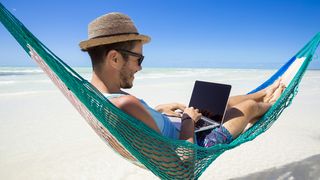 Man on hammock working