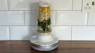 The Millo Smart Portable Blender loaded with fruit and vegetables ready to be blended into a smoothie