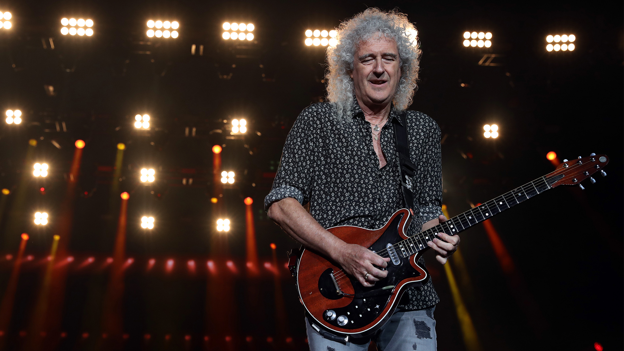 Brian May of Queen performs during Fire Fight Australia at ANZ Stadium on February 16, 2020 in Sydney, Australia.