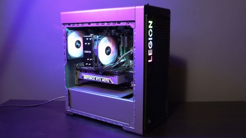 Lenovo Legion Tower 5i PC on a table with a purple light on it