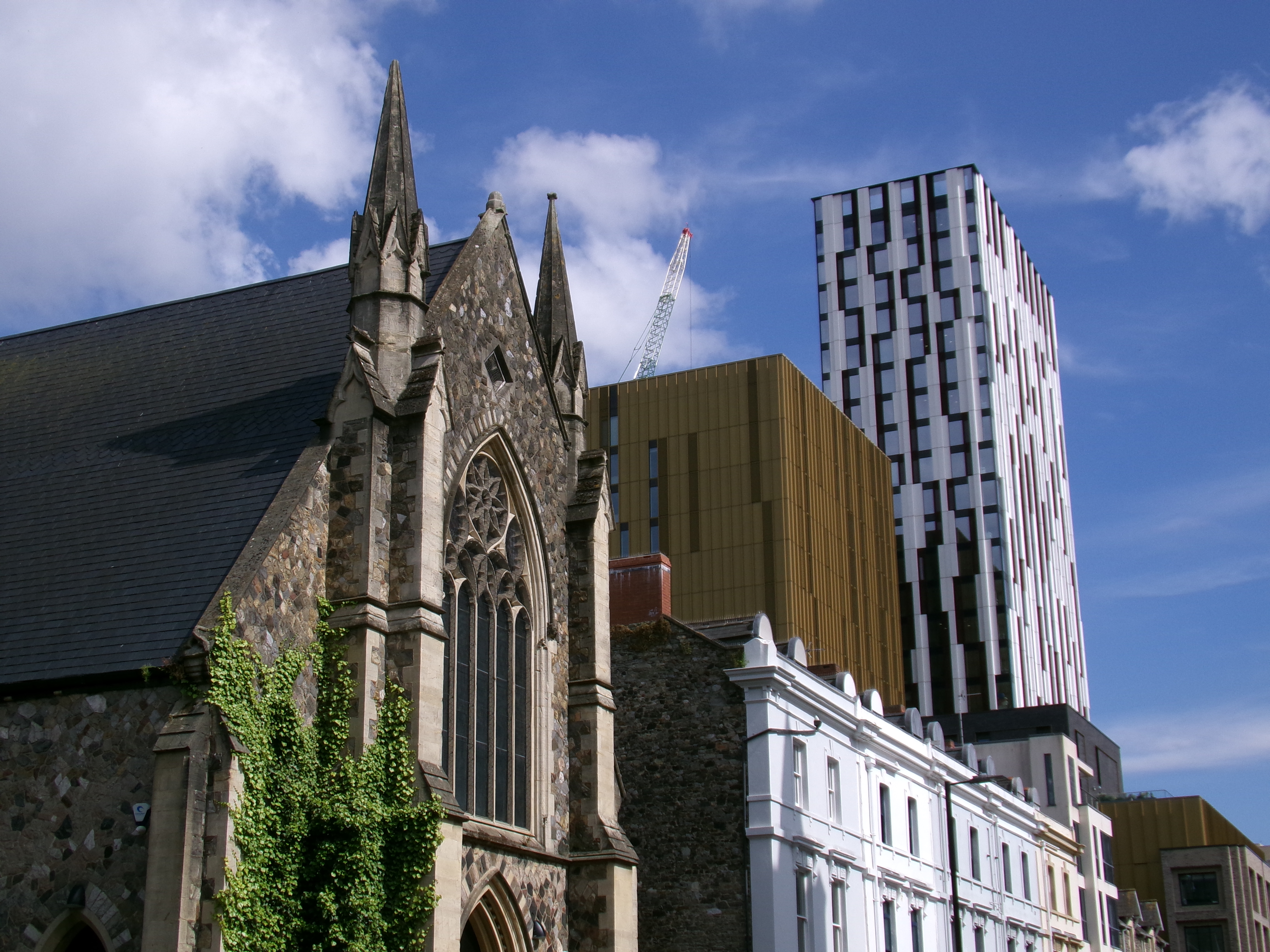 Church and other buildings in front a blue sky