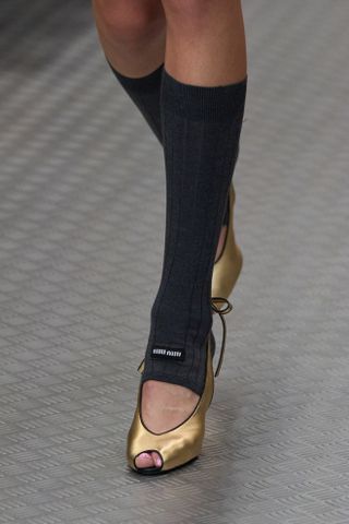 Woman in peep toe heels on Miu Miu runway