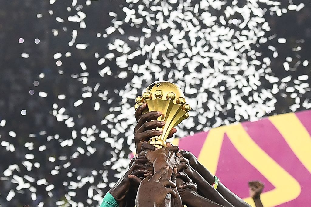 AFCON 2023 Senegal&#039;s players hold the trophy after winning the Africa Cup of Nations (CAN) 2021 final football match between Senegal and Egypt at Stade d&#039;Olembe in Yaounde on February 6, 2022. (Photo by CHARLY TRIBALLEAU / AFP) (Photo by CHARLY TRIBALLEAU/AFP via Getty Images)