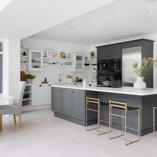 modern grey Shaker kitchen with kitchen island and white wall units