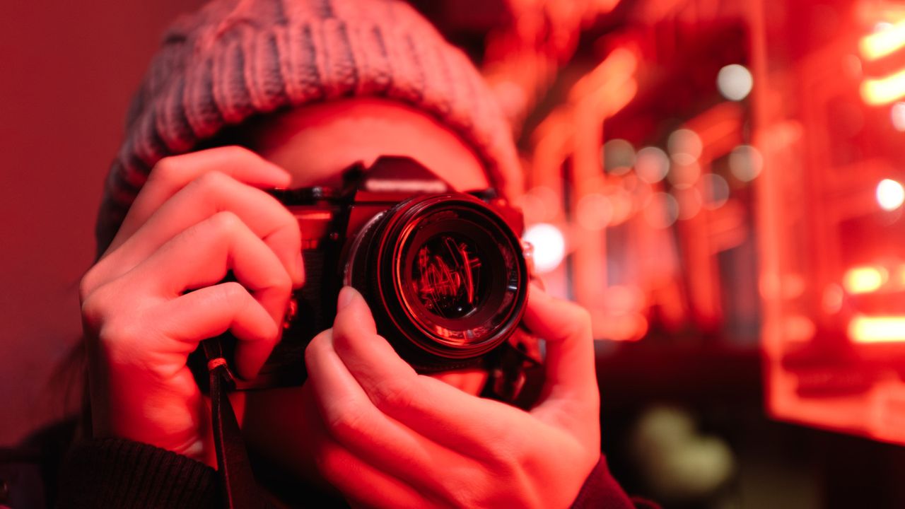 person taking a picture with a camera