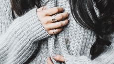 Close up of woman's hands with rings on