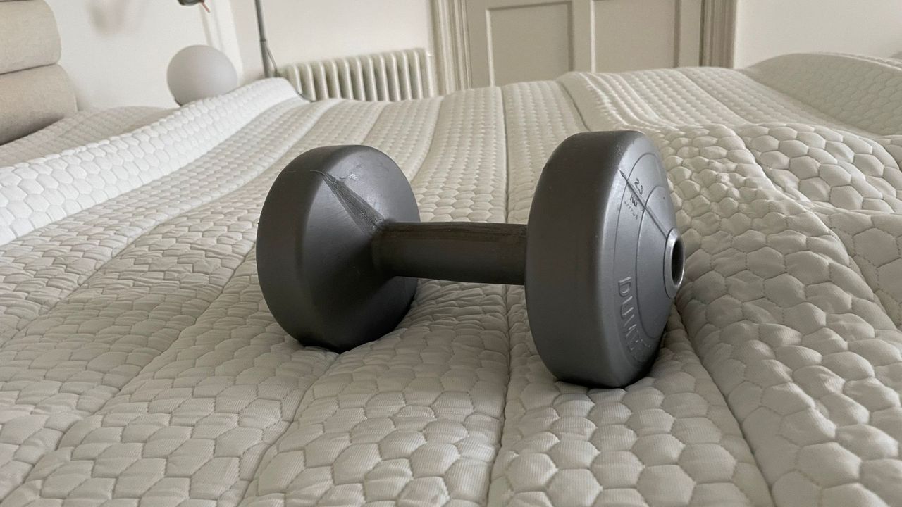 Soak&amp;Sleep Cooling Mattress Topper with a dumbell