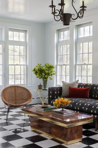 sunroom with dark sofa