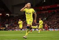 Richarlison celebrates scoring during the Premier League match between Liverpool and Tottenham Hotspur at Anfield, running, hand to his ear.