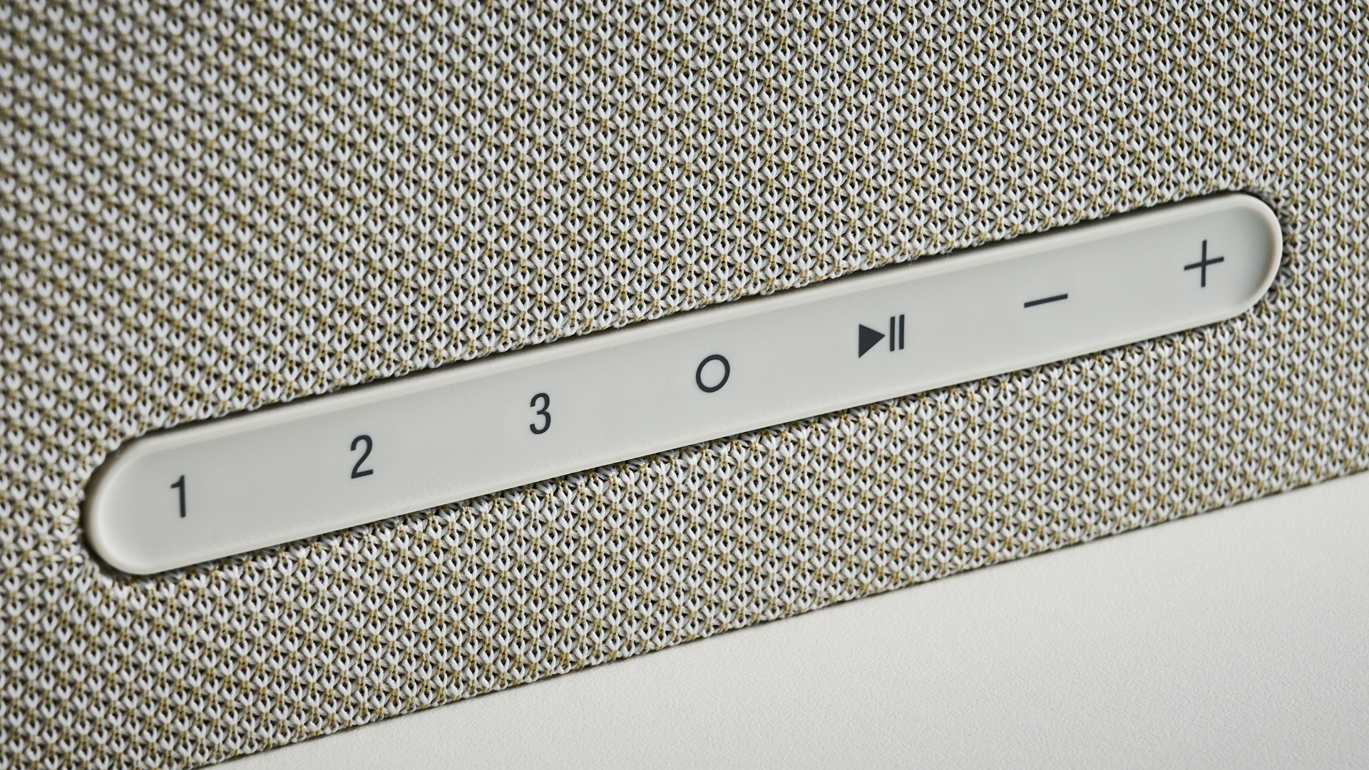 the denon home 600 home speaker photographed with the blue tom's guid e background