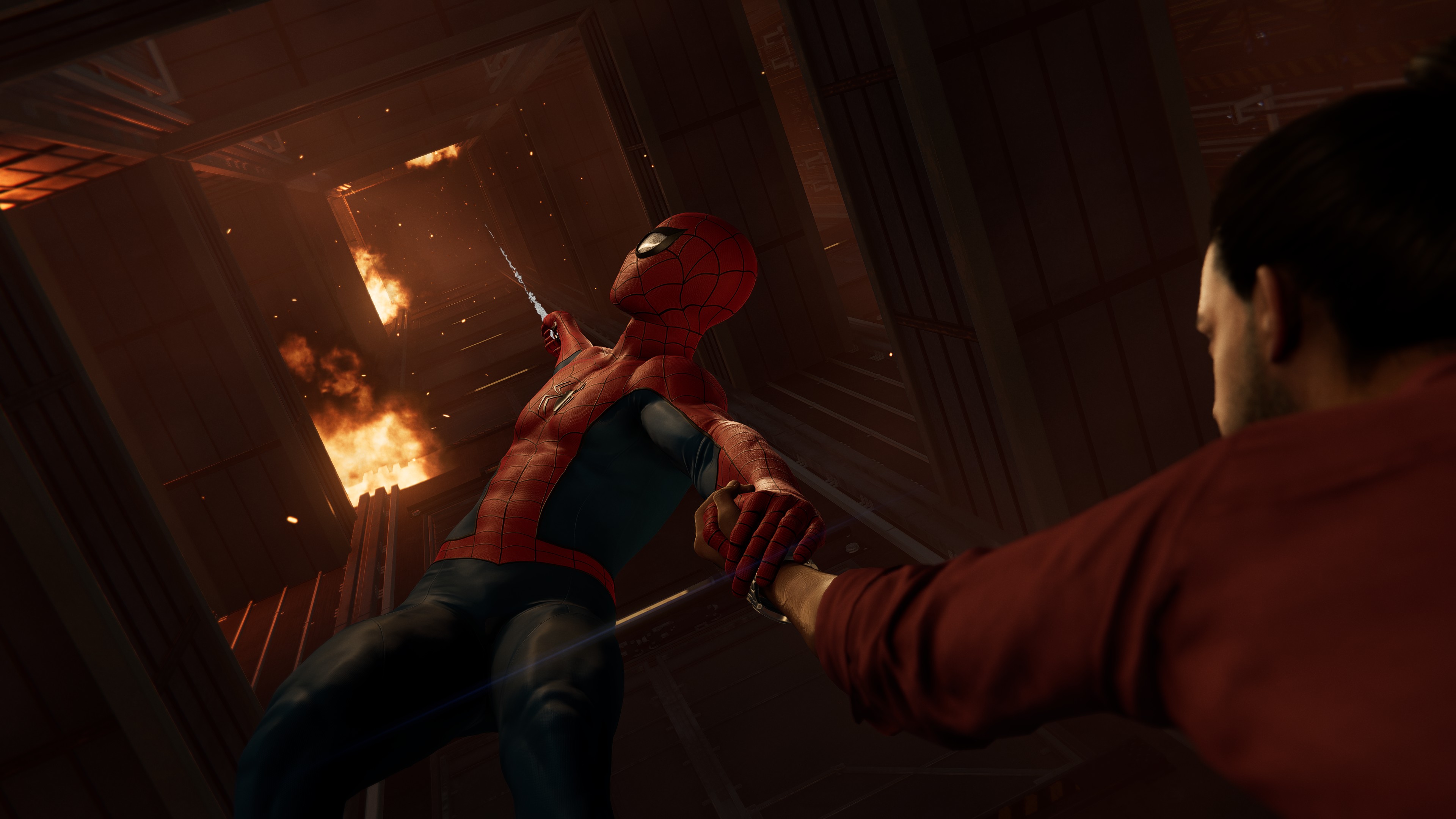 Spider-Man saving someone from a burning building