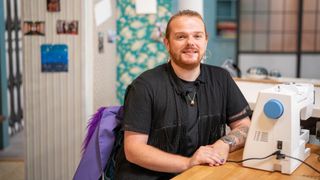 Matthew in a black t shirt for The great British Sewing Bee 2023