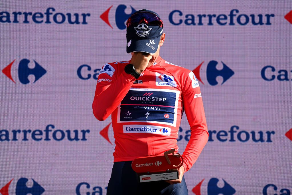 NAVACERRADA SPAIN SEPTEMBER 10 Remco Evenepoel of Belgium and Team QuickStep Alpha Vinyl Red Leader Jersey celebrates at podium during the 77th Tour of Spain 2022 Stage 20 a 181km stage from Moralzarzal to Puerto de Navacerrada 1851m LaVuelta22 WorldTour on September 10 2022 in Puerto de Navacerrada Spain Photo by Justin SetterfieldGetty Images
