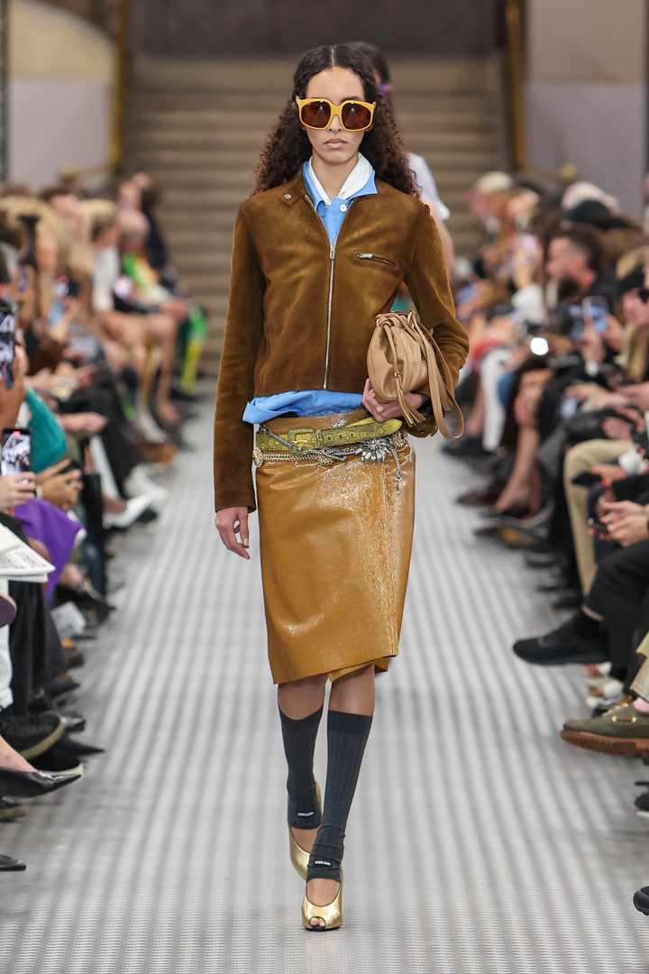 a Miu Miu model walks the spring/summer 2025 catwalk