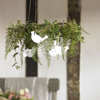 hanging wreath with leaves and paper birds