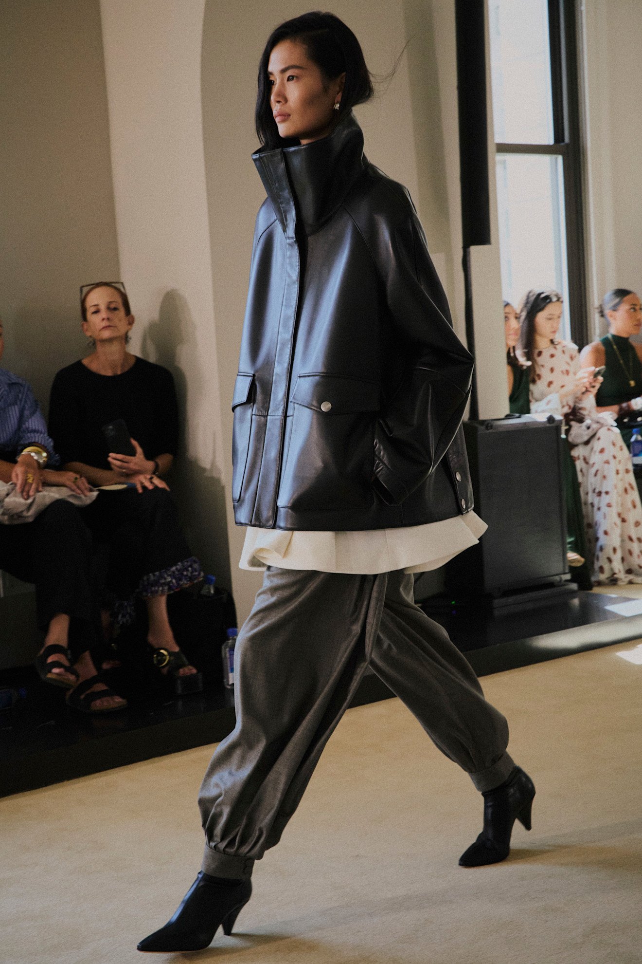 An image of a funnel neck jacket on Altuzarra&#039;s spring/summer 2026 runway.