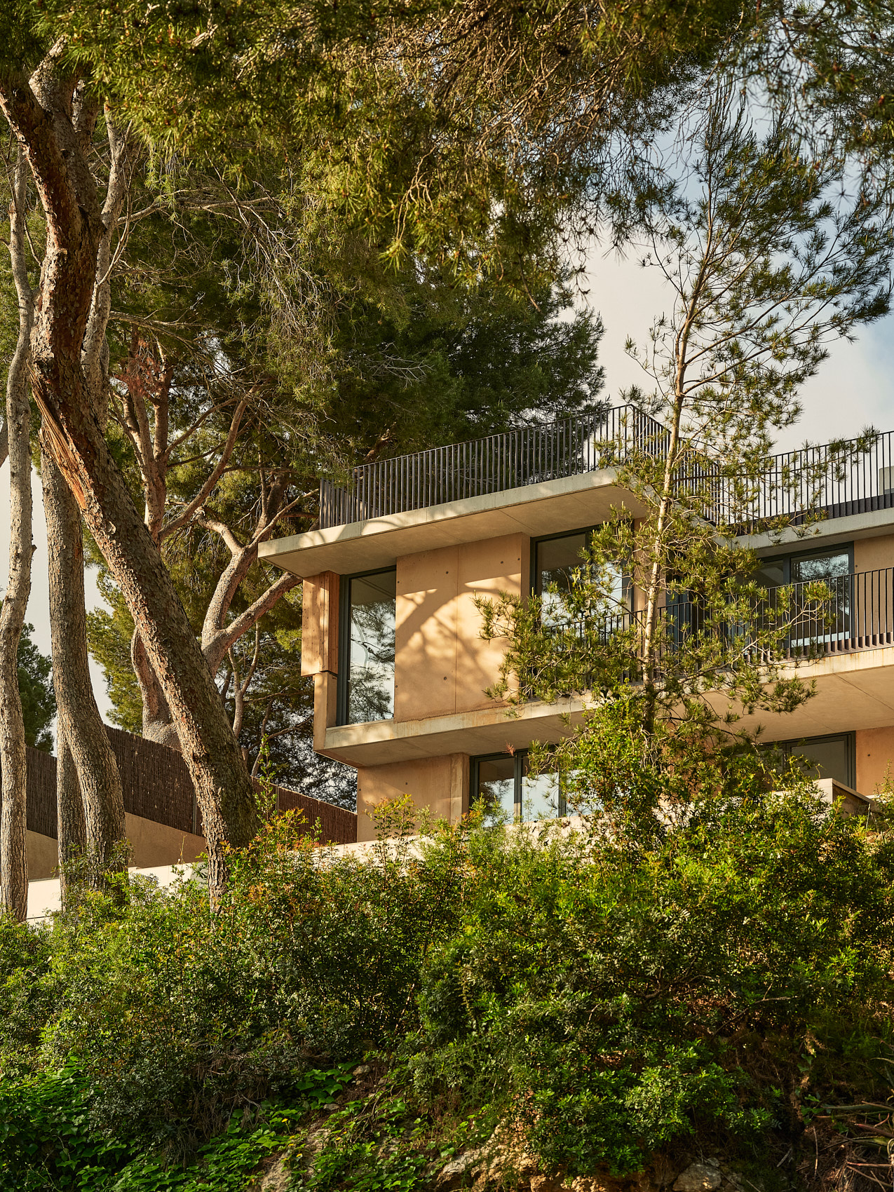 Spanish house Cala Tamarit, textured house among nature