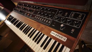 A Prophet-5 synthesizer in a home studio