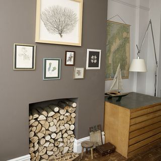 living room fireplace chimney breast is painted in an earthy shade of brown in victorian terrace in bristol