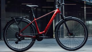 Orbea Kemen e-bike in red, in an urban setting