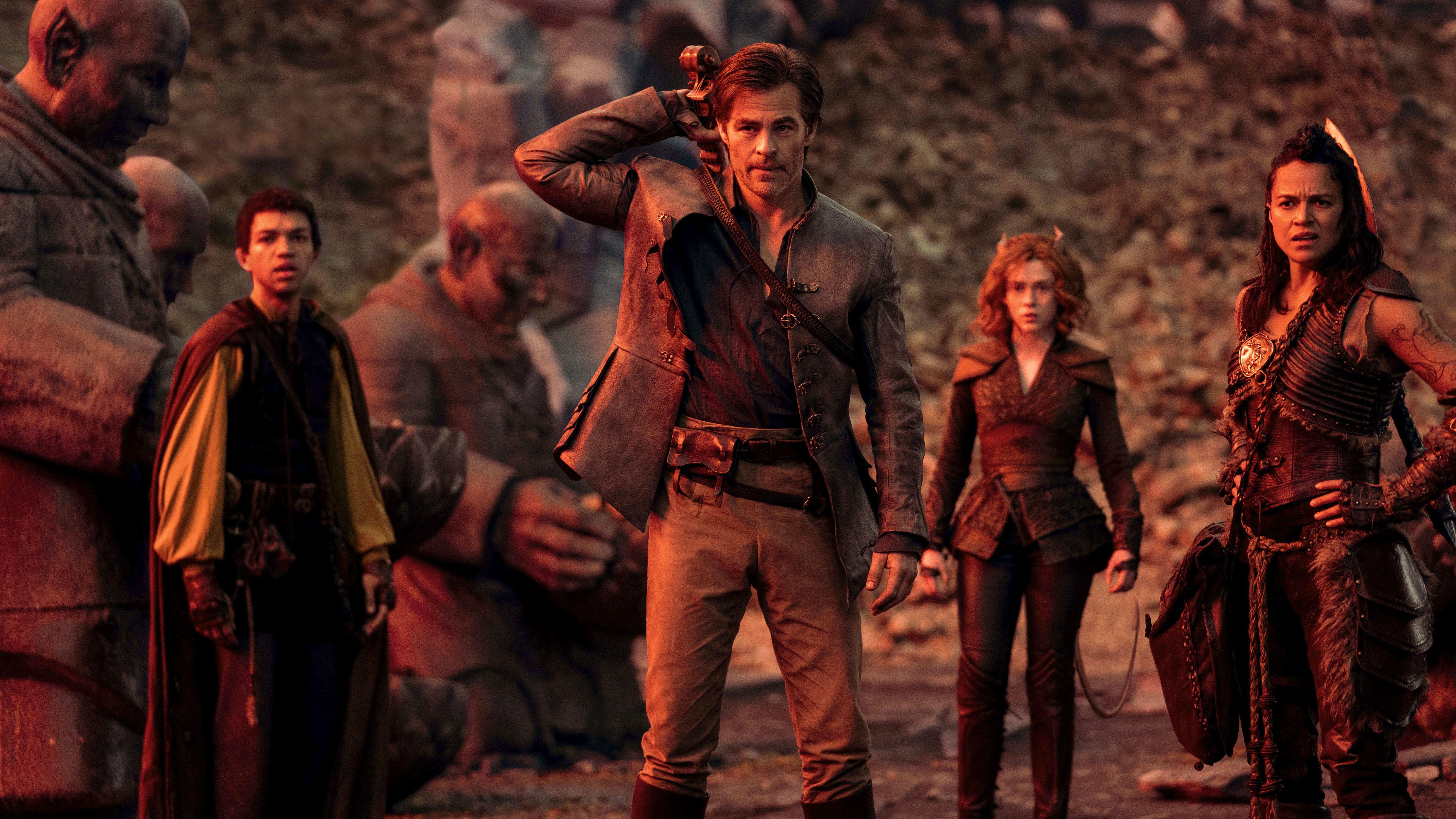 (From L to R) Justice Smith as Simon the Sorcerer, Chris Pine as Edgin Darvis, Sophia Lillis as Doric, and Michelle Rodriguez as Holga the Barbarian.