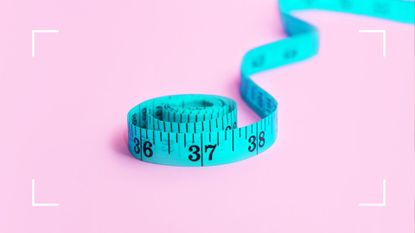 tape measure to signify losing belly fat