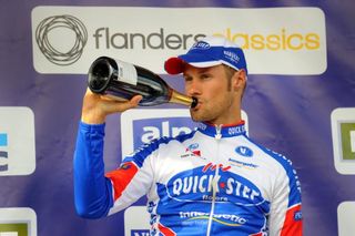 Tom Boonen (Quick Step) on the podium with the obligatory champagne.