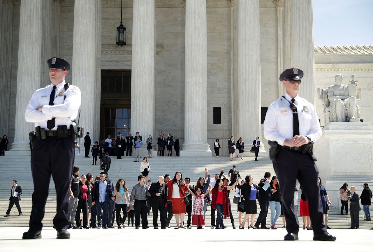 Immigration supporters on the steps of the Supreme Court.