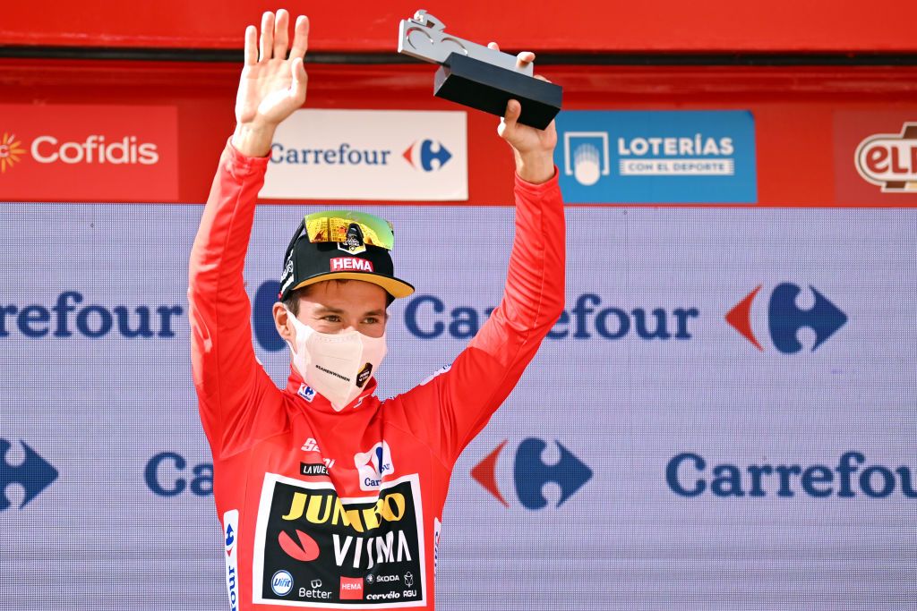 BURGOS SPAIN AUGUST 15 Primoz Roglic of Slovenia and Team Jumbo Visma celebrates winning the Red Leader Jersey on the podium ceremony after the 76th Tour of Spain 2021 Stage 2 a 1667km stage from Caleruega Monasterio de Santo Domingo de Guzmn to Burgos Gamonal lavuelta LaVuelta21 CapitalMundialdelCiclismo on August 15 2021 in Burgos Spain Photo by Stuart FranklinGetty Images
