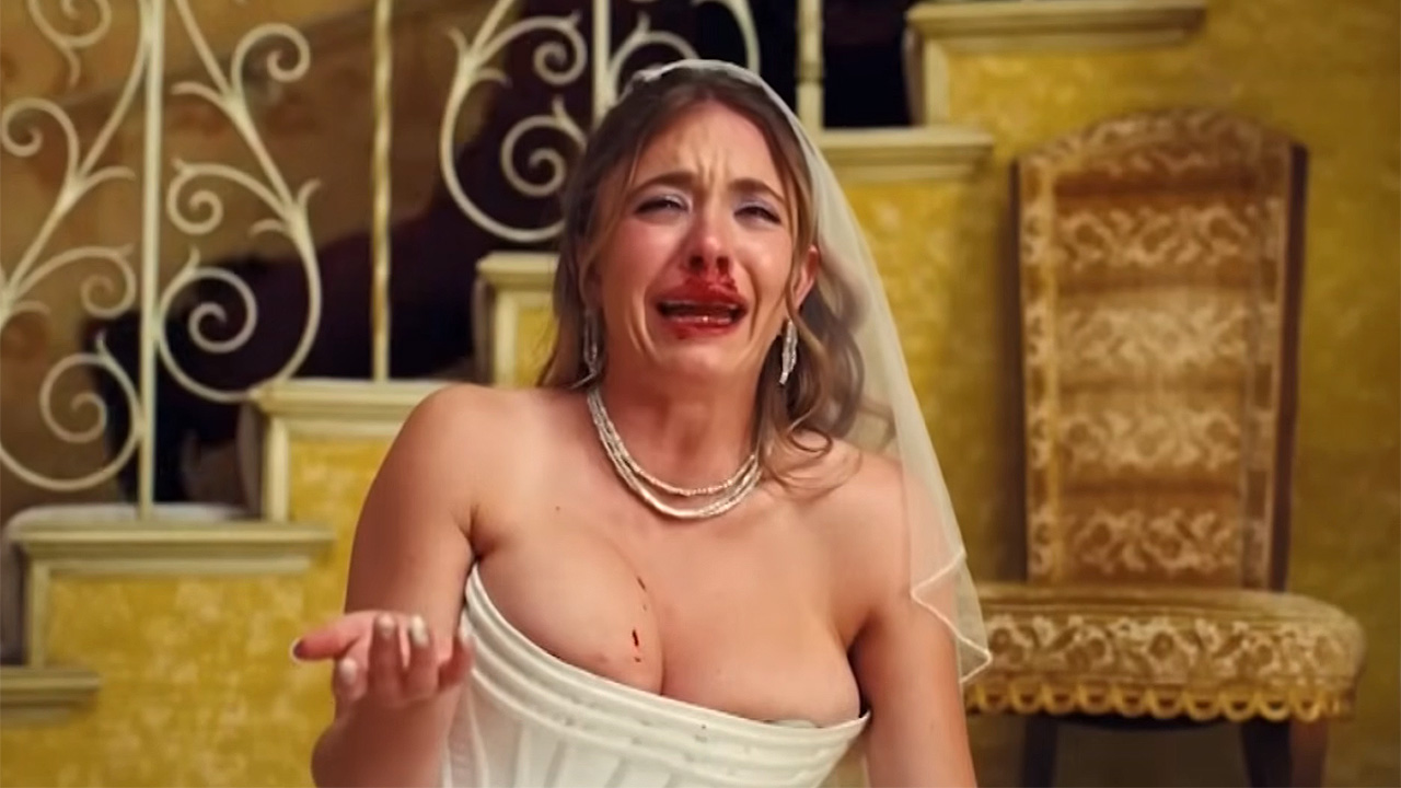 Sydney Sweeney crying in wedding dress by stairwell with blood on her face, Euphoria Season 3.