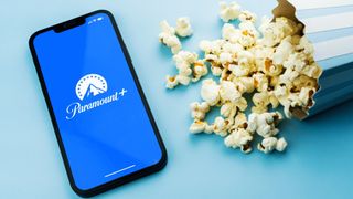 Paramount Plus app on a phone next to popcorn