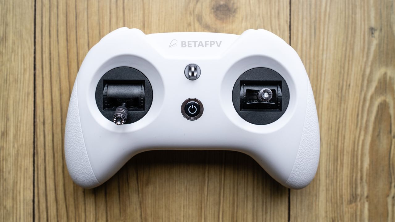 BetaFPX Cetus X drone controller on wooden table