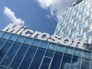 Photo of a Microsoft building with clouds in view