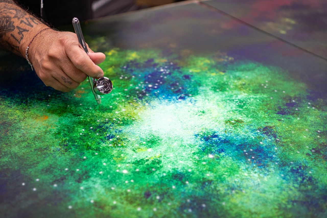 Cyril Kongo hand-painting the Starlight Headliner at Rolls-Royce