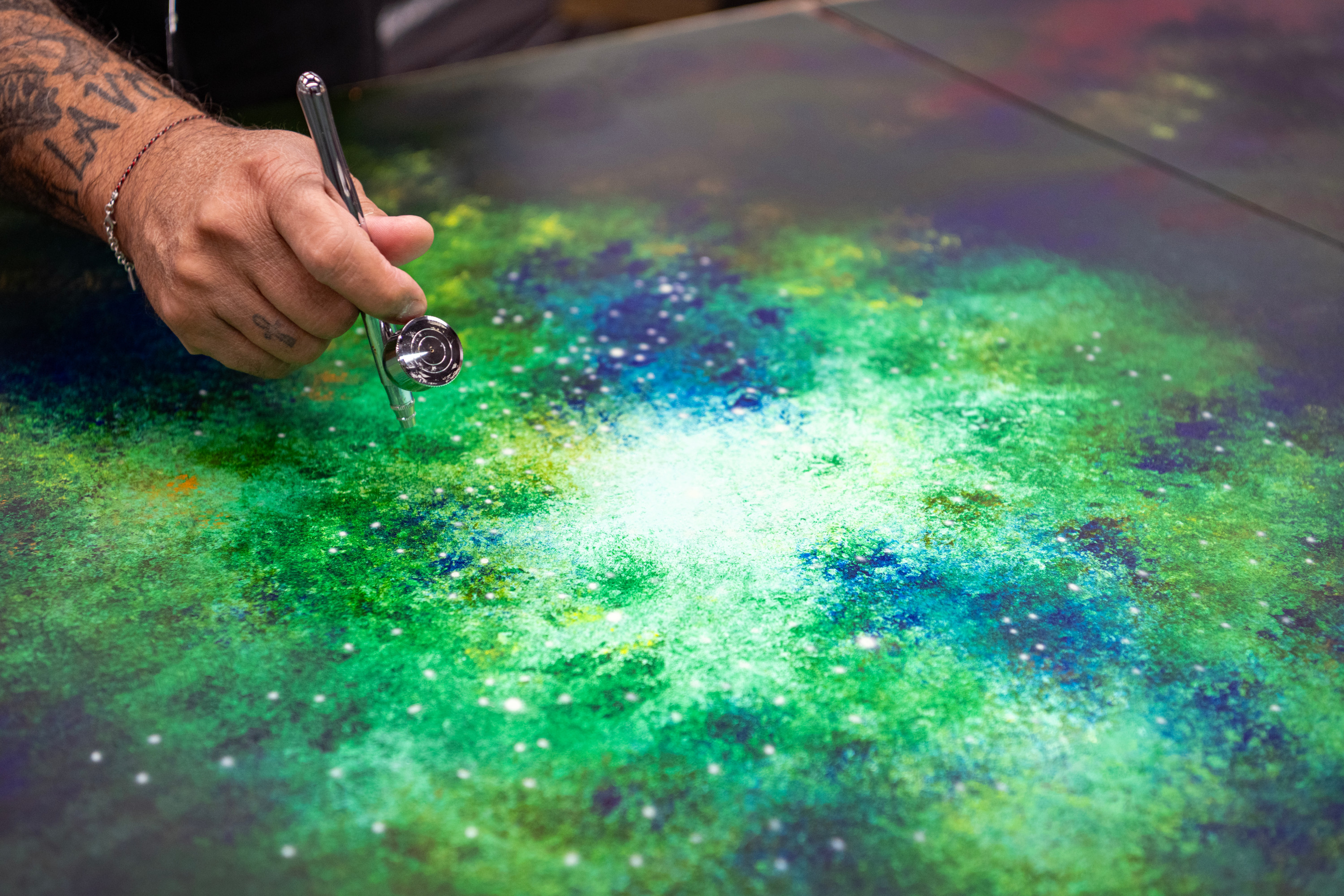 Cyril Kongo hand-painting the Starlight Headliner at Rolls-Royce